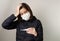 Asian woman have fever and wear the medical mask to protect and fight infection from germ, bacteria, covid19, corona , sars , infl