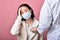 Asian woman have sore throat allergy and coughing in face mask, Sneezing and coughing spread coronavirus disease droplet.