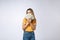 Asian woman holding cash notes isolated in white background. Young asian woman in white t-shirt in winning surprise