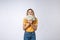 Asian woman holding cash notes isolated in white background. Young asian woman in white t-shirt in winning surprise