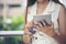 Asian woman holding credit cart and using tablet to shopping online