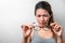 Asian woman holding glasses on white background, Selective focus on glasses , myopia and eyesight problem concept