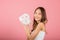 Asian woman holding purifying mask face on hands