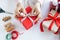 Asian woman holding red gift box  on the hands offer to you on christmas tree background