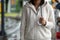 Asian woman holding umbrella while waiting taxi and standing on the city sidewalk street in rainy day