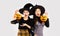 Asian woman in holloween costume witch black hat and carrying the pumkin lantern on white background