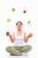 Asian woman juggling fruits