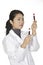 Asian woman laboratory technician examining a tube of blood