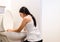 Asian woman with morning sickness,Pregnant female nausea into the toilet bowl