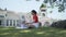 Asian woman mother playing with happy baby infant in garden on sunny day under tree on picnic vacation. smile baby happy fun