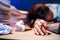 Asian woman overwork and sleep on the table after she feeling very try.Depression and anxiety