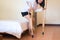 Asian woman patient using crutches and broken leg for walking in bedroom,Close up