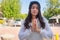 Asian woman pay homage to a Buddha image