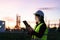 Asian woman petrochemical engineer working at night with digital tablet Inside oil and gas refinery plant industry factory at