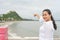 Asian woman is pointing ot Thammikaram Temple at Khao Chong Kr