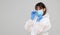 Asian woman puts on a protective mask and suit. Protected against flu, ebola, tuberculosis, virus.