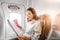 Asian Woman reading magazine in airplane, vacation and leisure concept