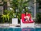 Asian Woman Relax on Swimming Pool Side