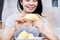 Asian woman relishes the sweet creaminess of Durian during the Durian season