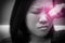 Asian woman rubbing her eye. Black and white tone and red spot on her eyes. Concept of  eye`s problem, dust allergy, dry eye,