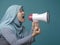 Asian woman Shouting with Megaphone, Side View