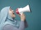 Asian woman Shouting with Megaphone, Side View