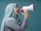 Asian woman Shouting with Megaphone, Side View