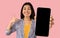 Asian woman showing empty smartphone screen and thumbs up