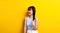 asian woman showing signs of happiness live happily good health optimistic view of the world on a yellow background