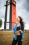 Asian woman sightseeing lighthouse seascape in europe travel outdoor recreation lifestyle concept.