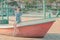 Asian woman sitting on a Beach boat relaxing for summer beach vacation concept