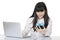 Asian woman sitting at desk stressed on white backgroun