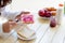 Asian woman slice jam bread in the morning and eating apple fruit,coffee healthy food breakfast