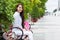 Asian woman smile sitting bench summer city