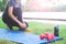 Asian woman in sport clothing tying shoes getting ready for exercise in park, Workout and Healthy lifestyle