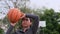 Asian woman in sportswear playing basketball at outdoor playground. Female basketball players practice outdoors on local courts.