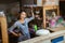 Asian woman stall seller standing relaxed with a stall background