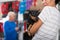 Asian woman standing in pet shop with her dog