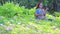 An asian woman with a sunglass playing ukulele