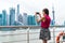 Asian woman taking phone picture on Shanghai ferry