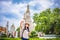 Asian woman tourist with backpack is taking a photo or selfie with smartphone during a travel and relax in holiday at pagoda arun