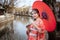 Asian woman tourists. Japanese girl wearing a kimono holding a red umbrella. Beautiful Female wearing traditional japanese kimono