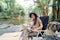 Asian woman travel and camping alone. Businesswoman online working and relaxing during journey outdoor