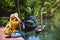 Asian woman travel nature. Travel relax.a boat photo. Sitting watching the beautiful nature at tha pom-klong-song-nam. Krabi, in