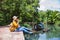Asian woman travel nature. Travel relax.a boat photo. Sitting watching the beautiful nature at tha pom-klong-song-nam. Krabi, in