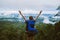 Asian woman travel nature. Travel relax. Freedom happy traveler woman standing with raised arms and enjoying a beautiful nature on