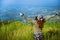 Asian woman travel nature. Travel relax. Standing natural touch grass on the Mountain at Khao-Khoâ€Ž. travel Thailand