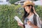 Asian woman traveler backpacker use map and mobile phone app to