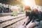 Asian woman traveler has tying shoe laces for traveling by train