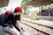 Asian woman traveler has tying shoe laces for traveling by train